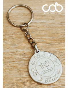 Porte clés en étain.